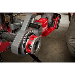 Worker using the 1-1/4" ALLOY NPT Compact Forged Aluminum Die Head