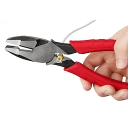 9" High Leverage Lineman's Pliers With Crimper in use, featuring red handles and a built-in wire crimper, held in a person's hand.