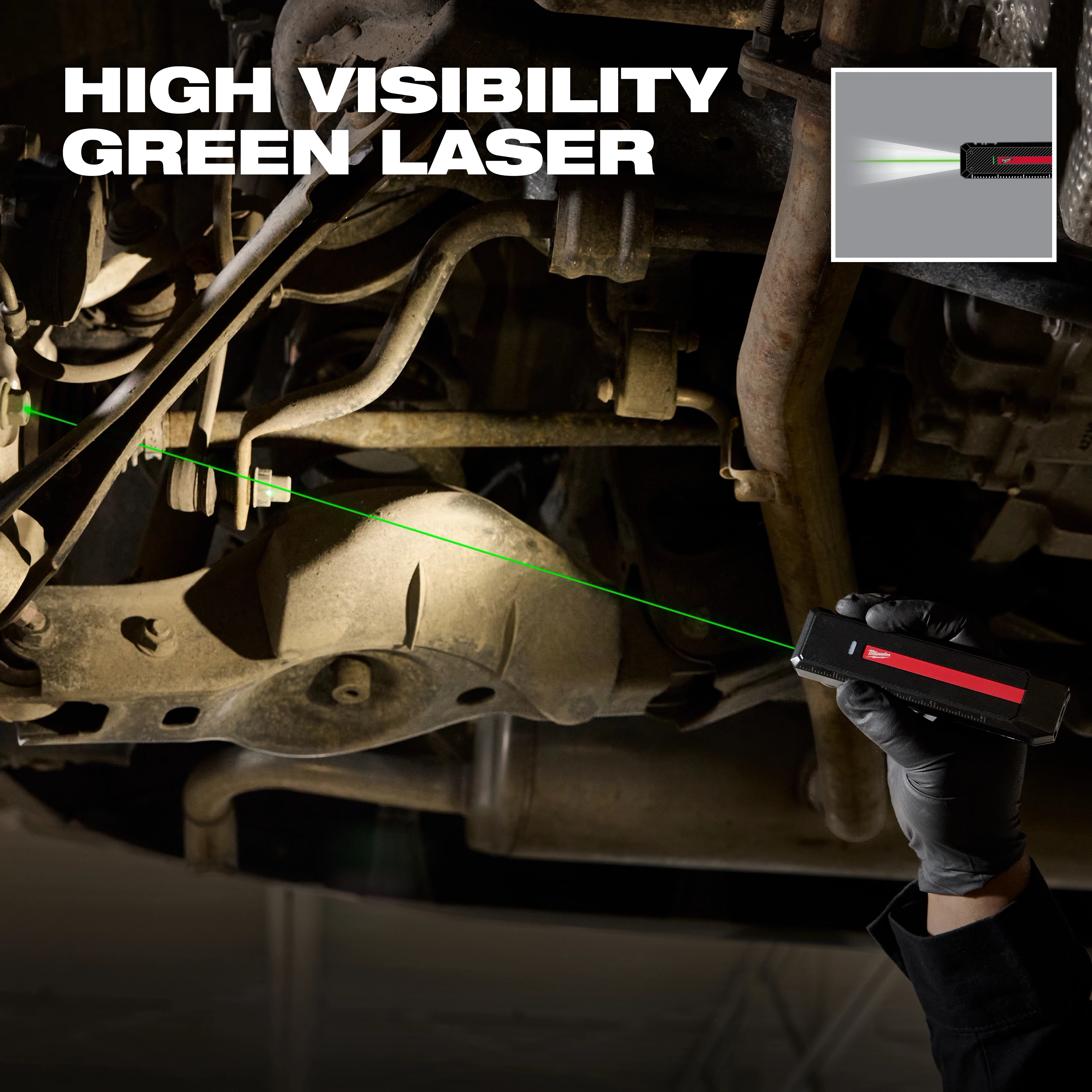 Milwaukee Rechargeable Flat Flashlight w/ Green Laser projecting a beam onto vehicle undercarriage components.