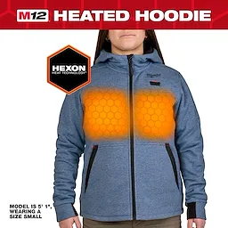 M12™ Heated Hoodie in blue features Hexon Heat Technology with glowing orange patterns indicating heating elements. Zippered front pockets and a hood provide warmth and convenience. The model, 5'1", wears a size small.