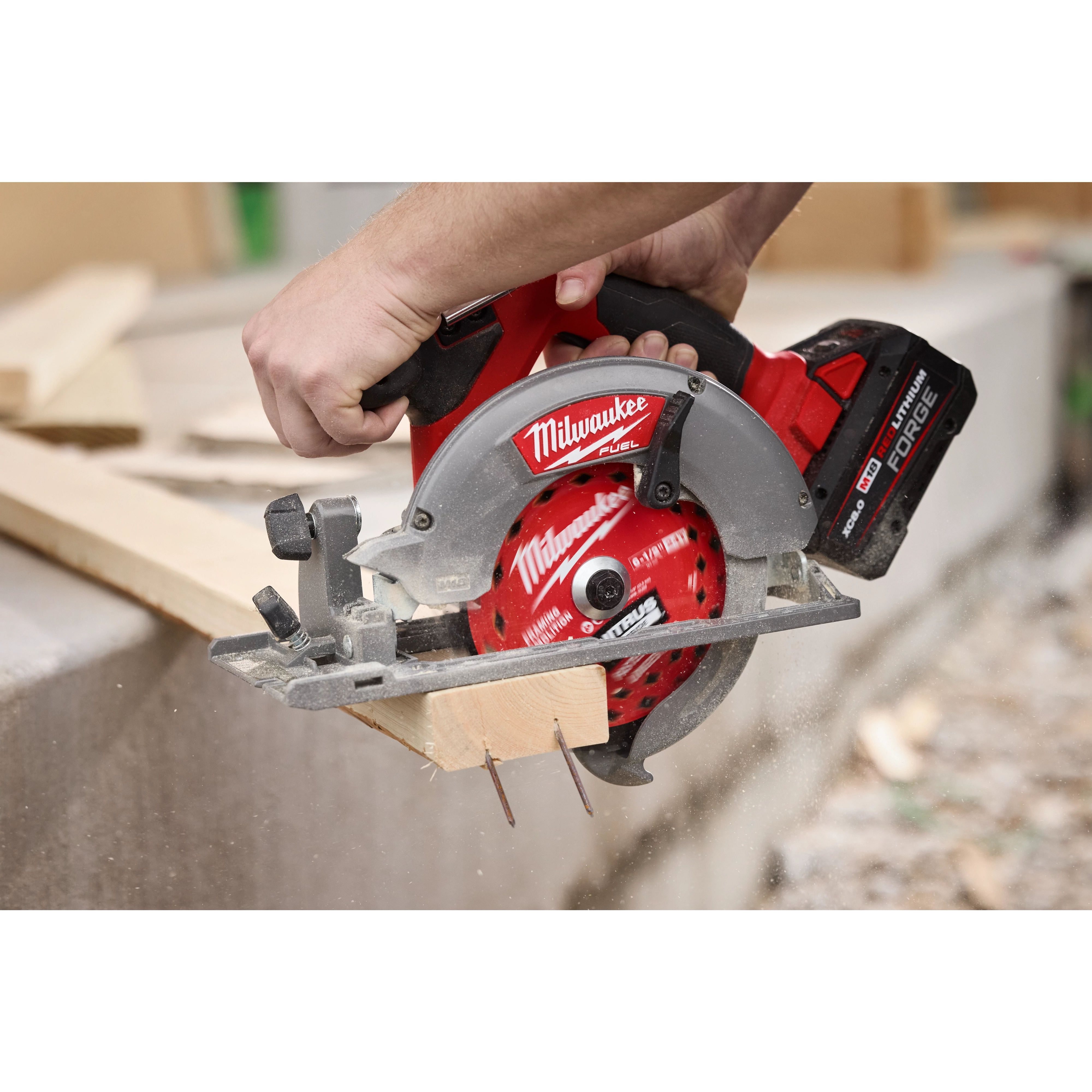 6-1/2” 24T NITRUS Carbide Framing & Demolition Circular Saw Blade cutting a wooden board outdoors.