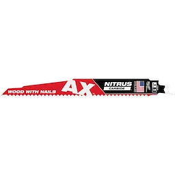 The image features the 9" 5 TPI AX™ w/ NITRUS™ Carbide Teeth SAWZALL® Blade for Wood with Nails. The blade is red and black, labeled with "AX," "NITRUS CARBIDE," and "WOOD WITH NAILS." An American flag sticker is also visible.