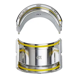 FORCELOGIC™ M18™ 750 MCM Crimper Kit showing two metallic crimping dies with yellow bands for identification. The upper die is semi-circular while the lower die is a full curved piece with "750" marking visible.