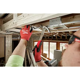 Worker using the Hammer Expansion on the jobsite to hammer in a nail