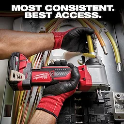 A worker wearing black and red gloves uses a Milwaukee cordless power tool to manipulate yellow wires in an electrical box. Text above the image reads: "Most consistent. Best access." The tool has a black and red body and a silver head.