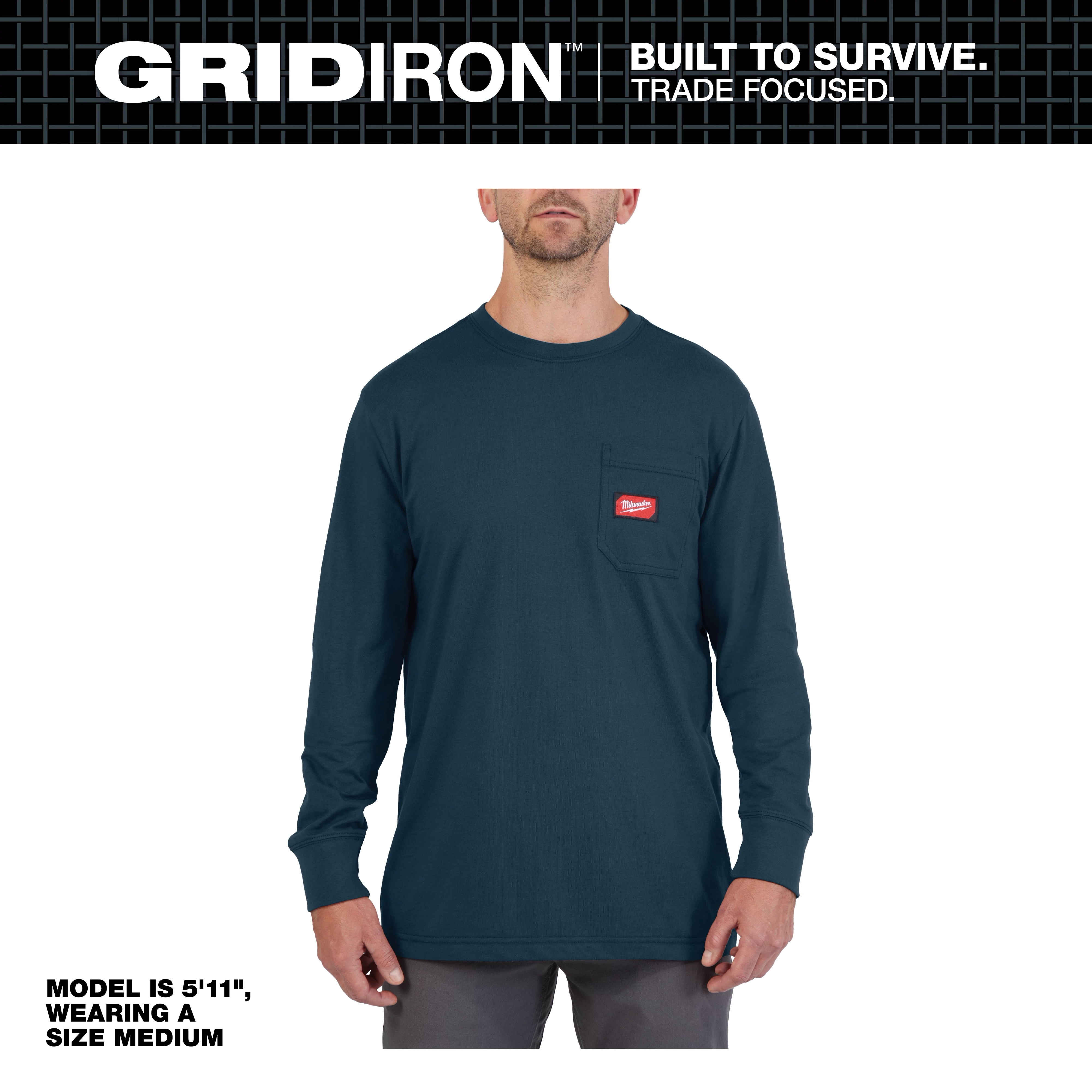 Model wearing a medium GRIDIRON Pocket Long Sleeve T-Shirt, dark blue with a chest pocket and red logo patch. He is 5'11".