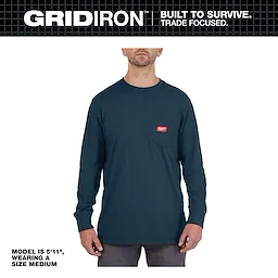 Model wearing a medium GRIDIRON Pocket Long Sleeve T-Shirt, dark blue with a chest pocket and red logo patch. He is 5'11".