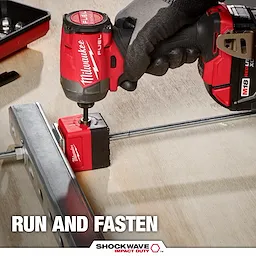 A Milwaukee power tool is used with the SHOCKWAVE™ Impact Duty 3/8" Threaded Rod Nut Runner to fasten a threaded rod to a metal bracket. The image includes branding and the slogan "Run and Fasten" at the bottom.