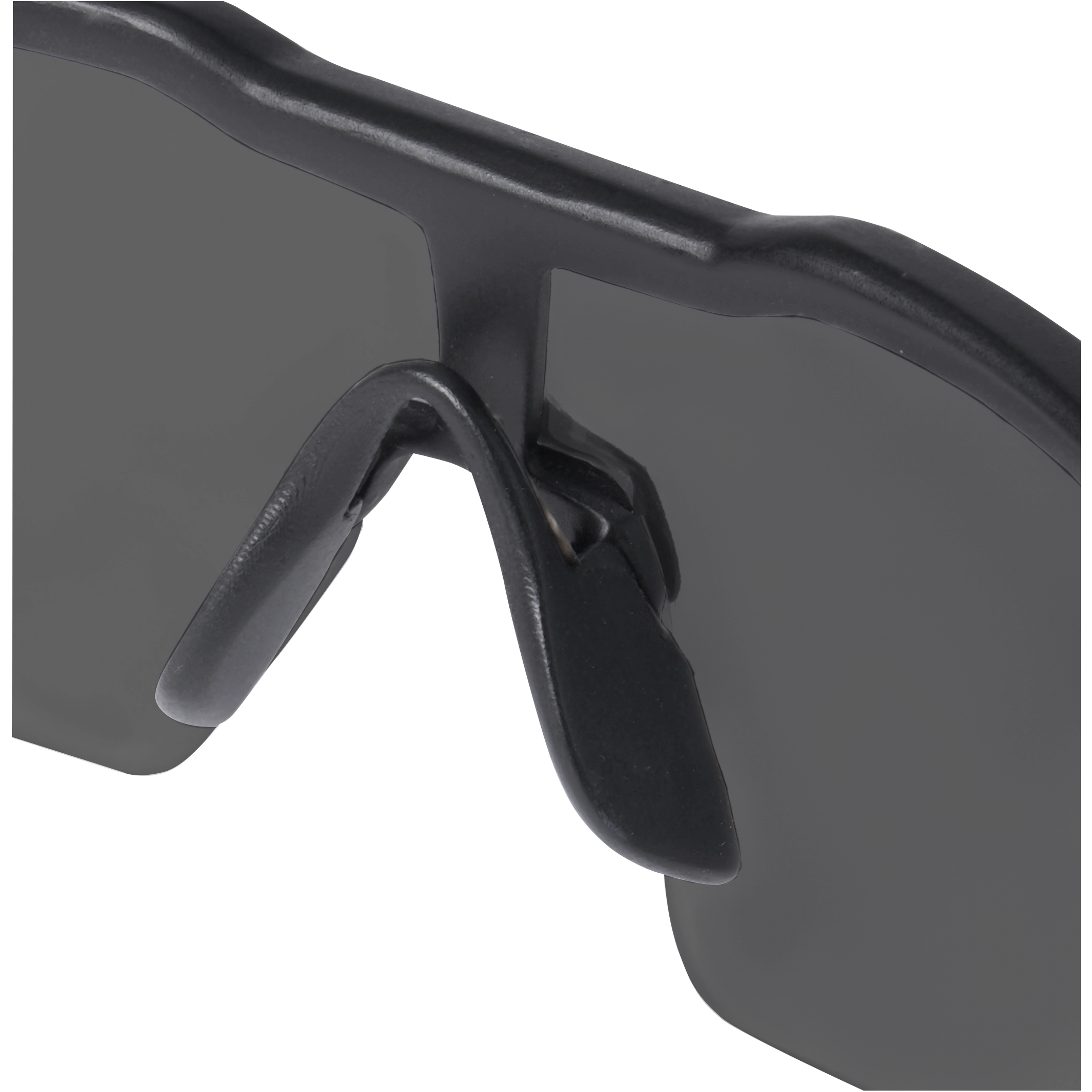 Close-up of Safety Glasses - Tinted Anti-Scratch Lenses focusing on the black nose pads and the edge of the tinted lenses.