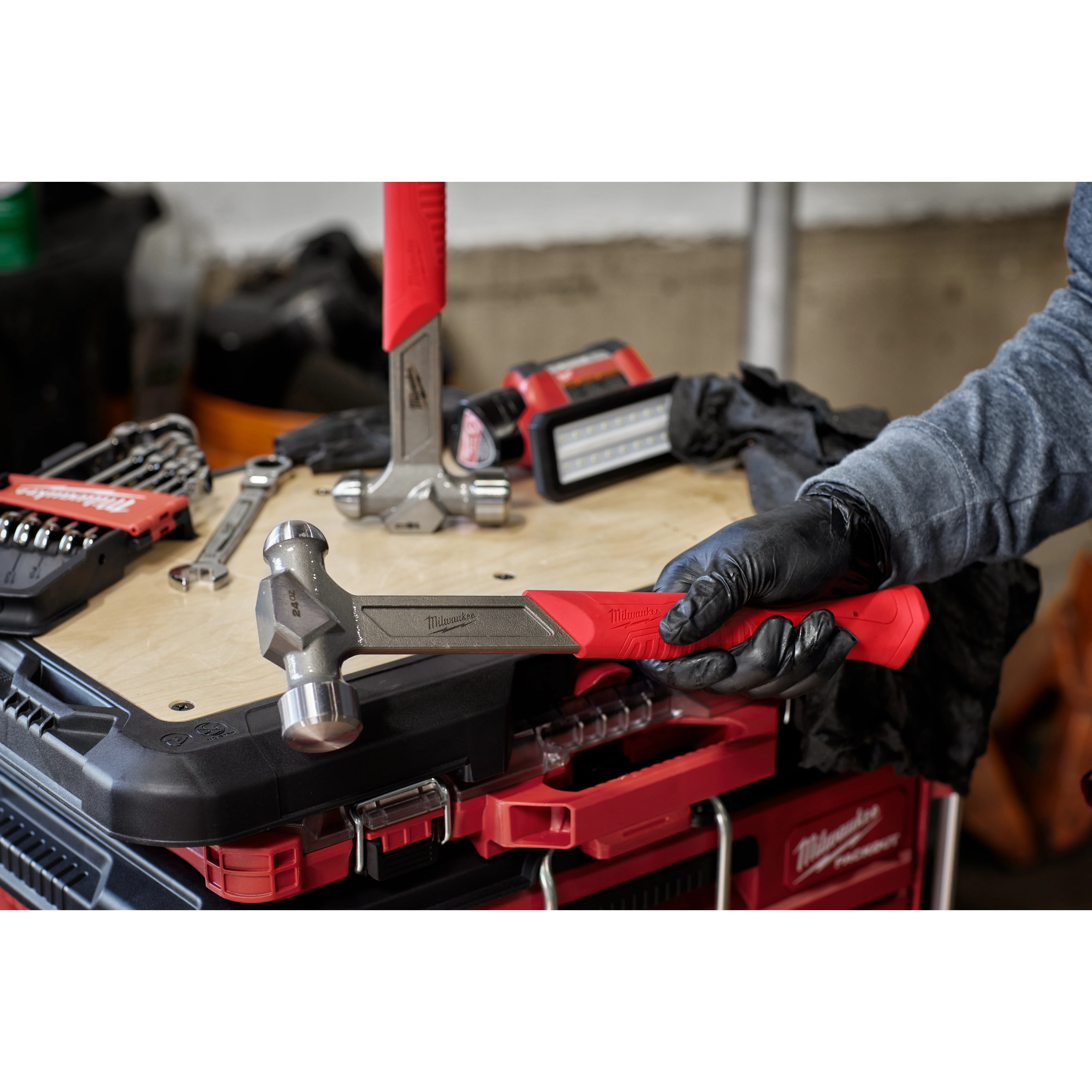 Worker holding the 24oz Steel Ball Peen Hammer