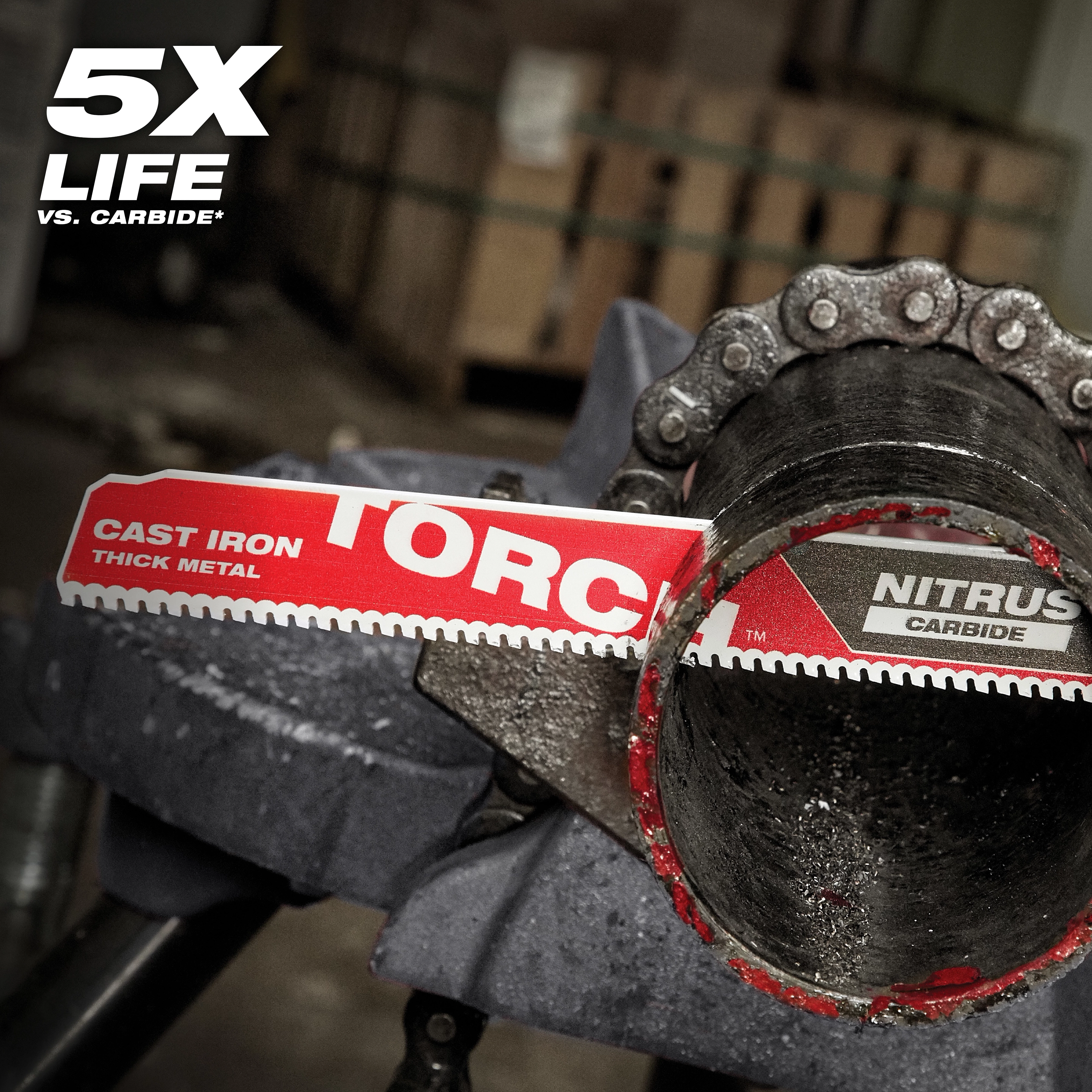 The product is the Nitrus Carbide Life Claim saw blade for cast iron and thick metal. The blade is red and white with text indicating its functions. It is cutting through a thick metal pipe, demonstrating its durability, labeled as "5X Life" in the upper left corner.