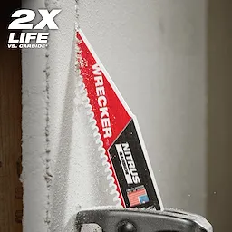 The Milwaukee Wrecker Nitrus Carbide Saw Blade is cutting through dense material. The blade is close to a wooden beam, producing fine dust particles. The text "2X LIFE" is prominently displayed in the top left corner.