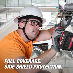 Worker wearing Full Frame Safety Glasses with Removable Side Shields – Clear Anti-Scratch Lenses, using a power tool.
