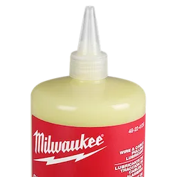 Milwaukee Wire & Cable Pulling Wax Lubricant bottle with a pointed nozzle cap, displaying red and white labeling.