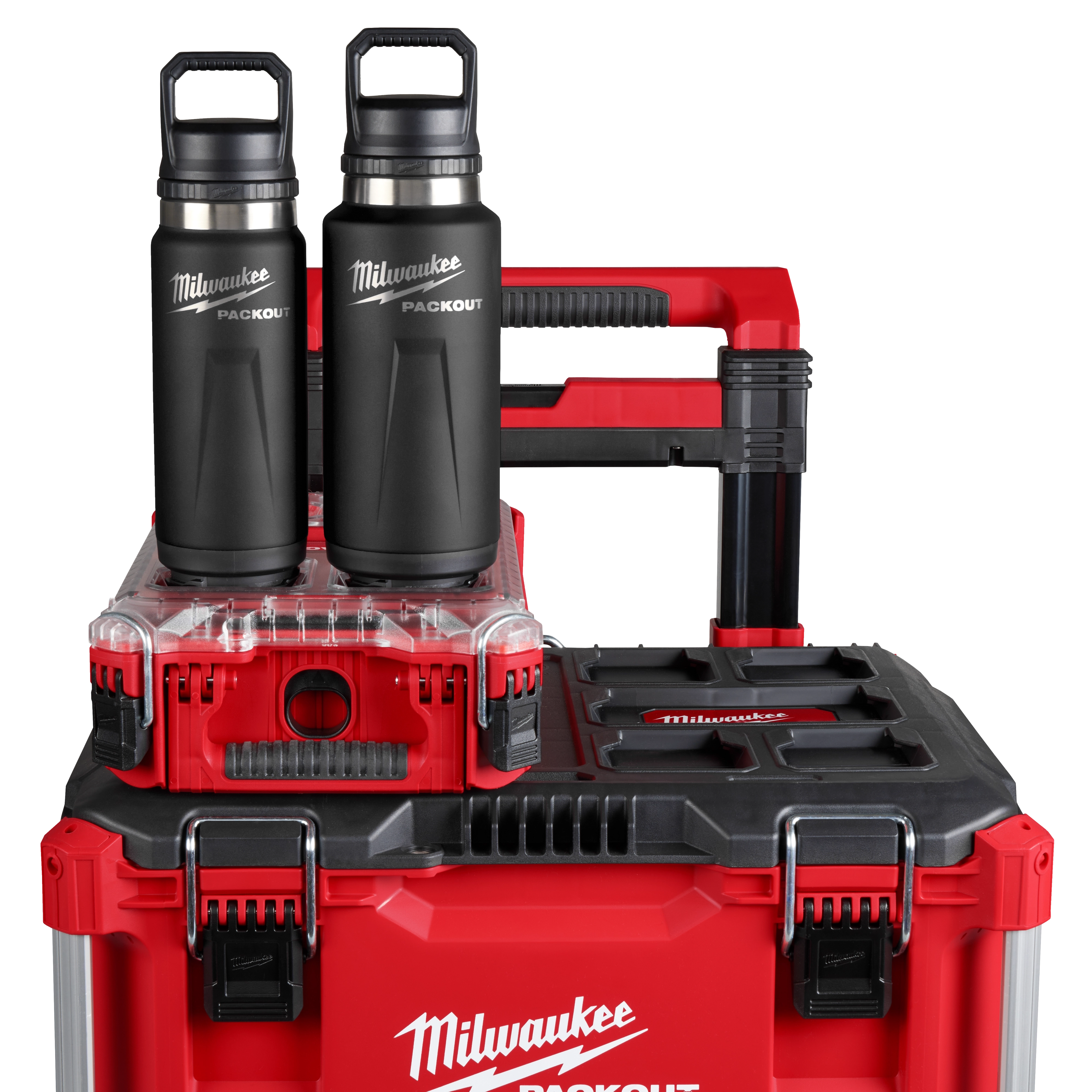 Two PACKOUT 24oz Insulated Bottles with Chug Lids are placed on top of a red and black stackable storage system.