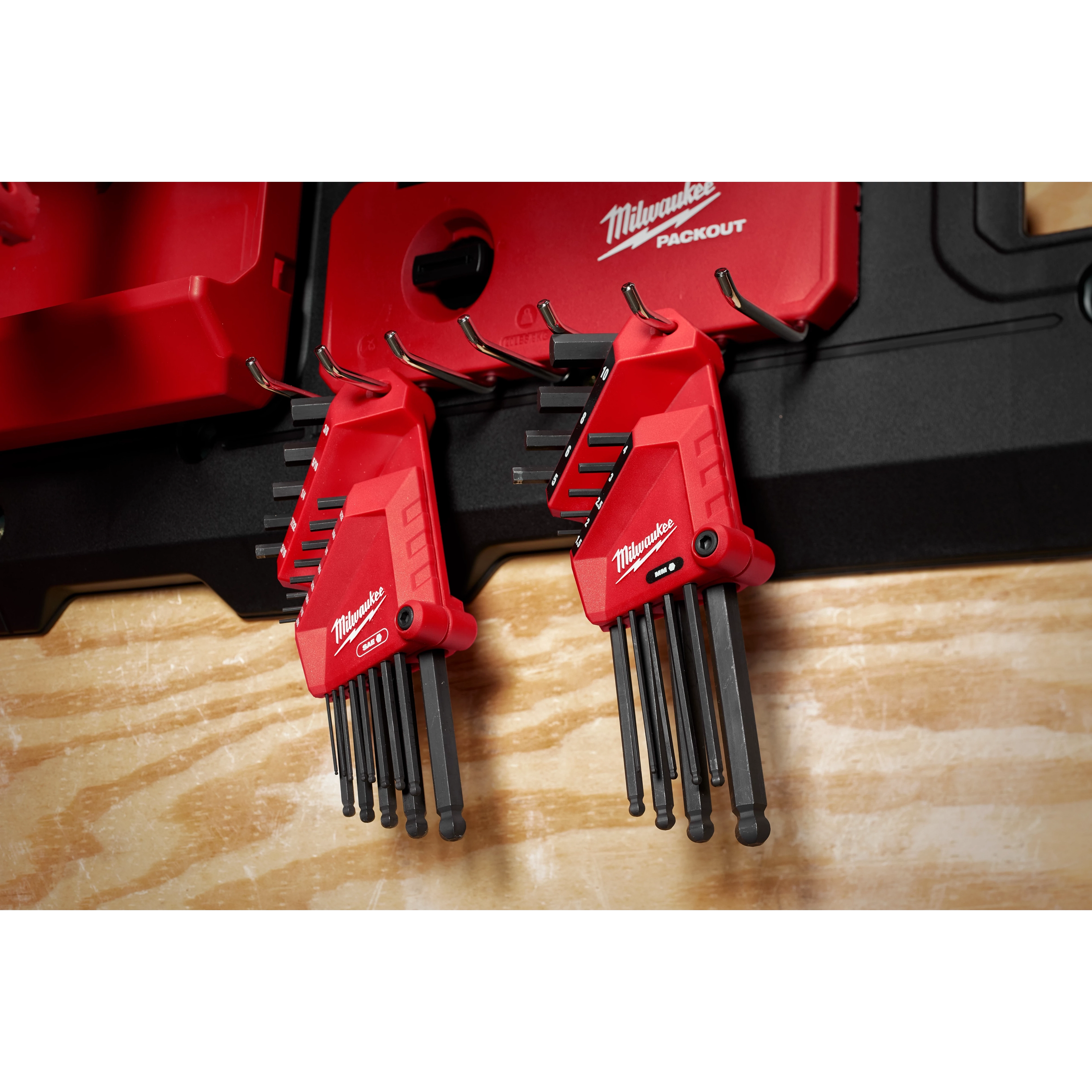 22-Key Ball End L-Key Set - SAE/Metric features red handles and are mounted on a black wall organizer.