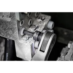 Shockwave Lineman's 6PT 9/16" x 3/4" 2-in-1 Socket attached to a ratchet wrench being used on industrial equipment.