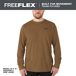 The FREEFLEX Hybrid Work Tee - Long Sleeve is shown in brown, worn by a model who is 6'2" and wearing a size large.