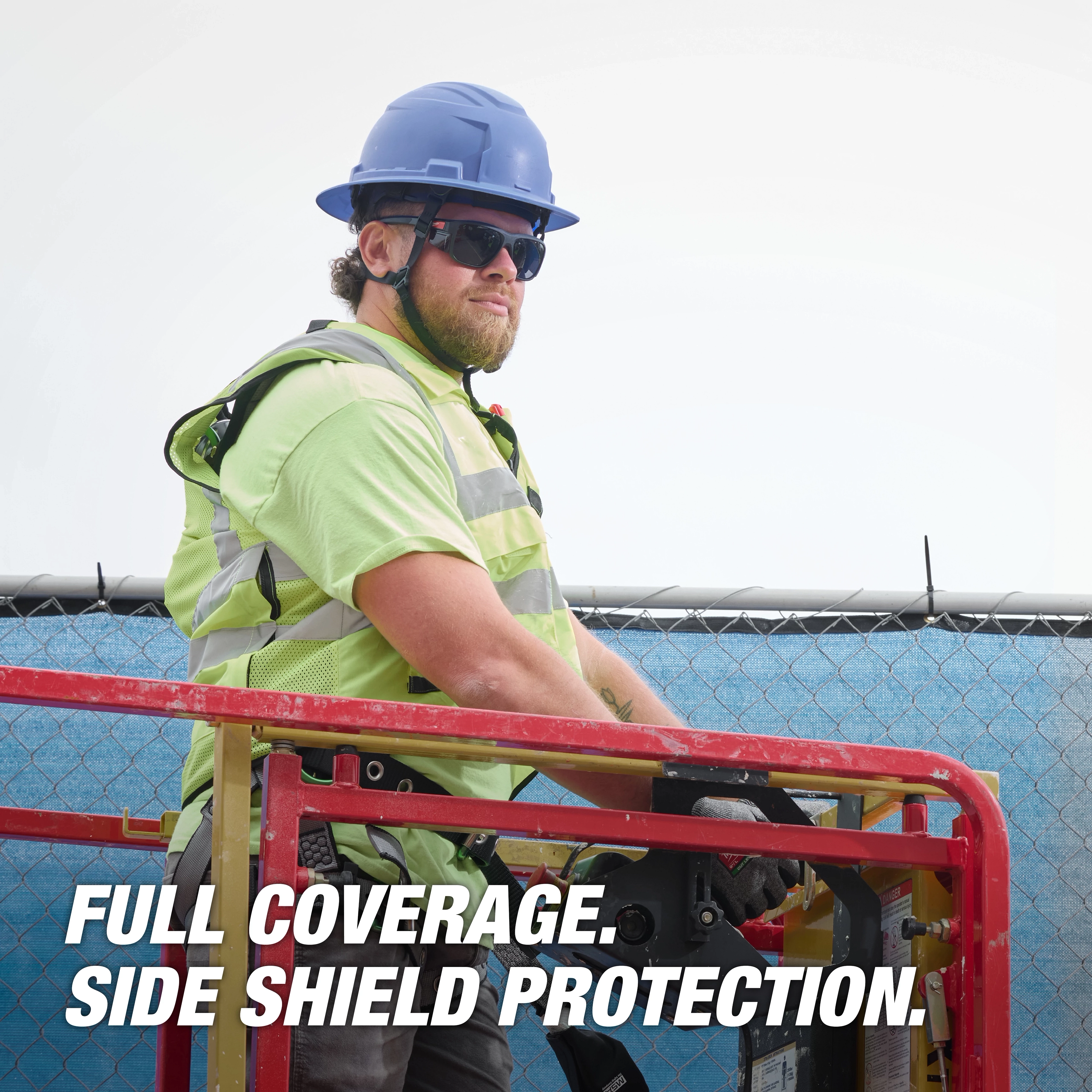 Worker wearing Polarized Full Frame Safety Glasses with Removable Side Shields and Mirrored Dual Coat Lenses operating equipment.