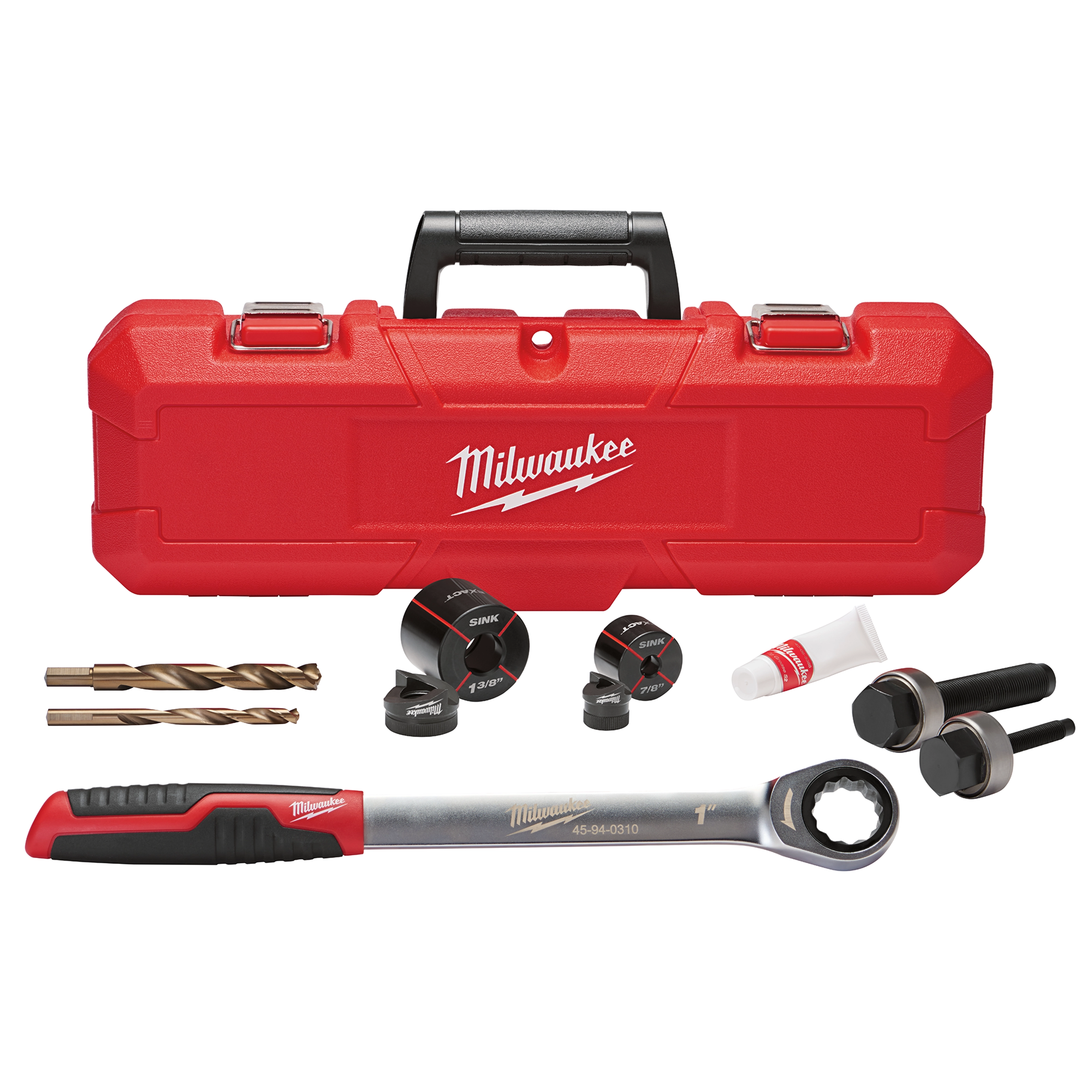 The Exact™ 1-3/8" Sink Knockout Set by Milwaukee includes a red carrying case, drill bits, three knockout sizes, wrench, and lubricant. The components are arranged in front of the case, showcasing the full set.