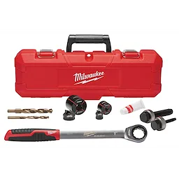 The Exact™ 1-3/8" Sink Knockout Set by Milwaukee includes a red carrying case, drill bits, three knockout sizes, wrench, and lubricant. The components are arranged in front of the case, showcasing the full set.