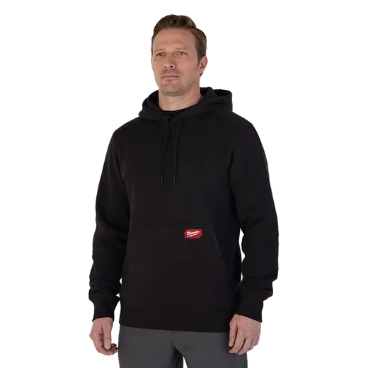 Man wearing the black midweight pullover hoodie