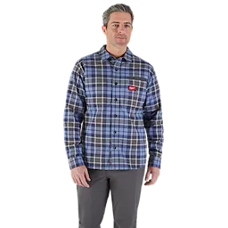 Man wearing a blue, gray, and black plaid GRIDIRON Flannel Shirt with a front chest pocket and an embroidered red logo.