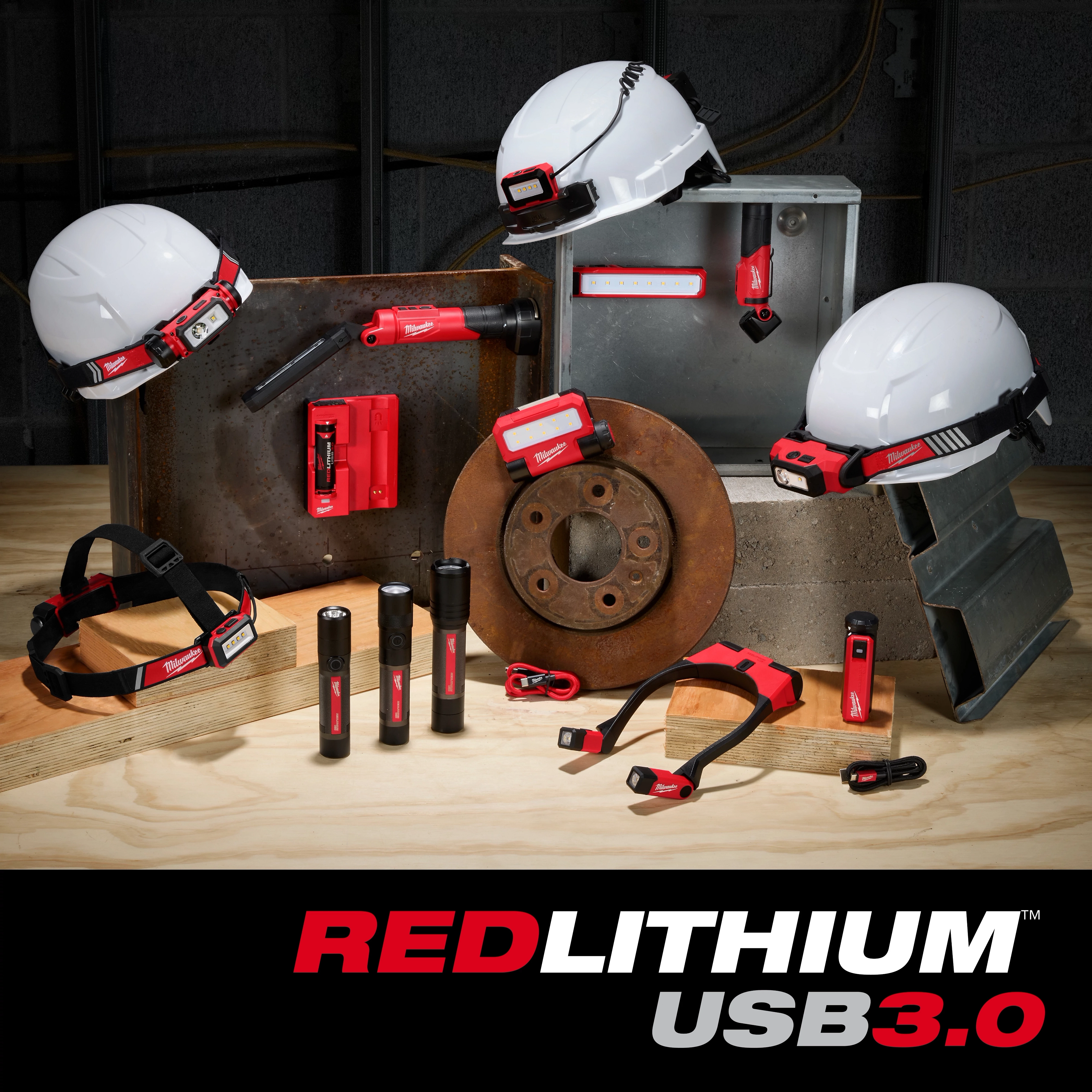The image displays various REDLITHIUM™ USB Family tools, including headlamps, flashlights, and a power bank, all showcasing the USB 3.0 technology. The products are arranged on a workbench alongside construction materials and safety helmets. The REDLITHIUM™ USB Family logo appears at the bottom.