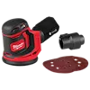 Milwaukee cordless random orbit sander with red and black color scheme. The sander includes a dust bag, an attachment, and three circular sanding pads. The Milwaukee logo is visible prominently on the side of the tool.