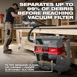 NEXUS™ Dedicated Debris Separator by Milwaukee, connected to a vacuum, separates up to 99% of debris before it reaches the filter. The product features a red design with gray transparent sections in the picture displaying internal workings.
