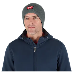 Image of a man wearing the Milwaukee Rib-Knit Cuffed Beanie in green
