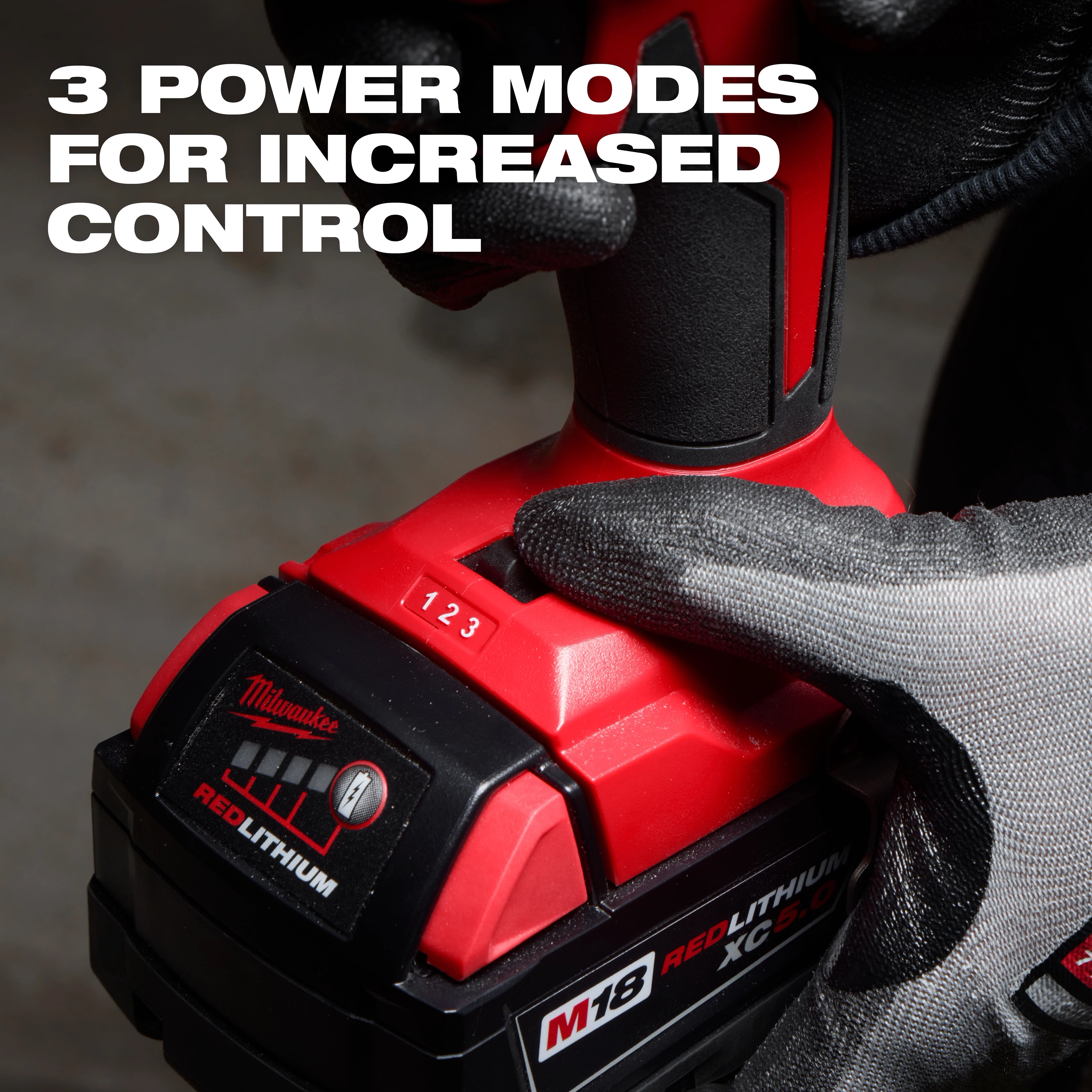 The M18™ Brushless Precision Blower features three power modes for increased control. The image shows a gloved hand adjusting the power mode slider from 1 to 2. The blower has a red and black design and operates with an M18 REDLITHIUM battery, highlighted by text in the image.