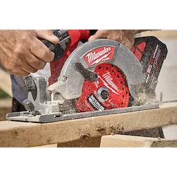 6-1/2” 24T NITRUS Carbide Framing & Demolition Circular Saw Blade cutting through a wooden board.