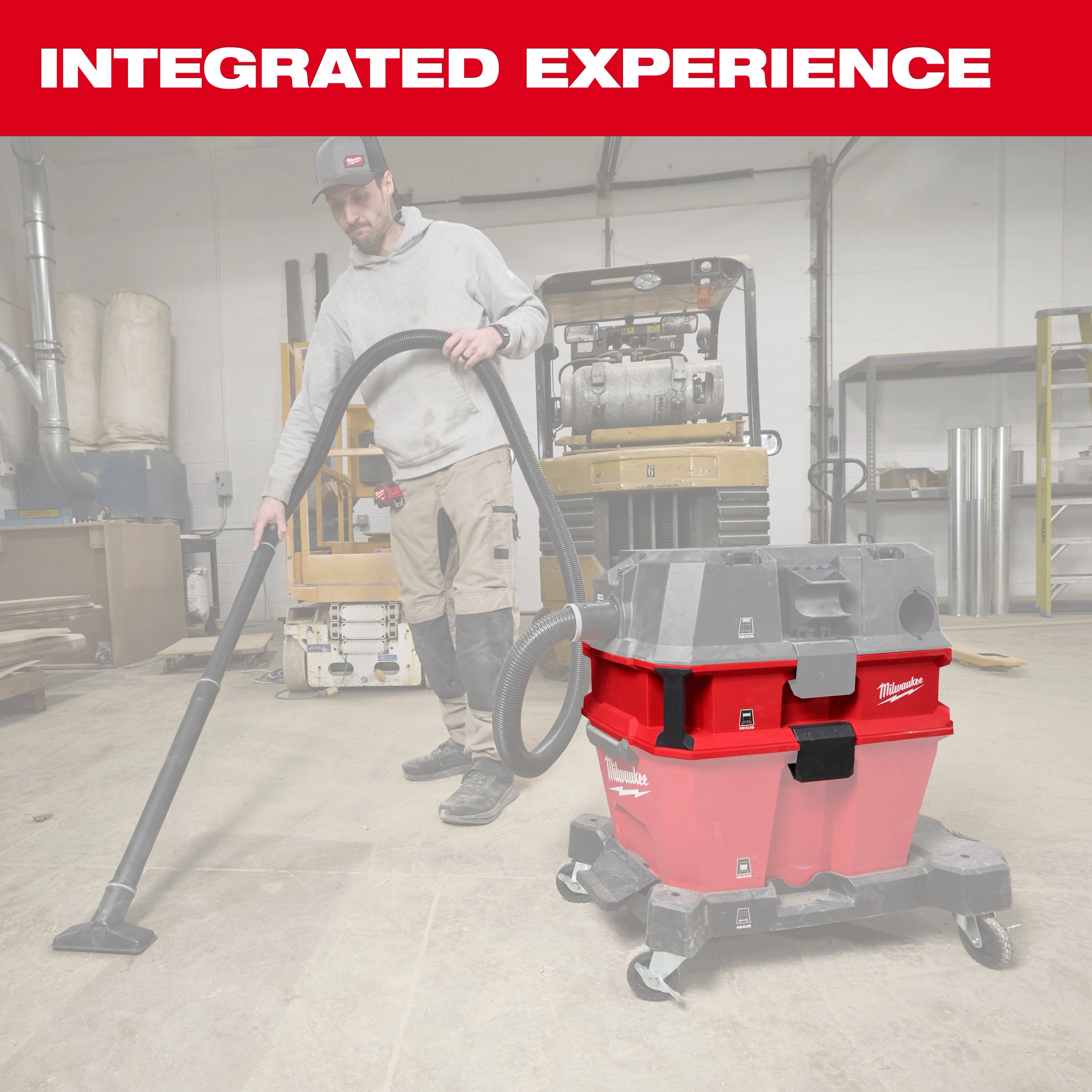 The image features the Milwaukee NEXUS™ Dedicated Debris Separator, a red and black heavy-duty vacuum attachment designed for construction or industrial environments. A worker uses the separator to collect debris on the floor. The text "INTEGRATED EXPERIENCE" is prominently displayed in red above the product.