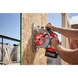 6-1/2” 24T NITRUS Carbide Framing & Demolition Circular Saw Blade cutting into an upright OSB wall panel.