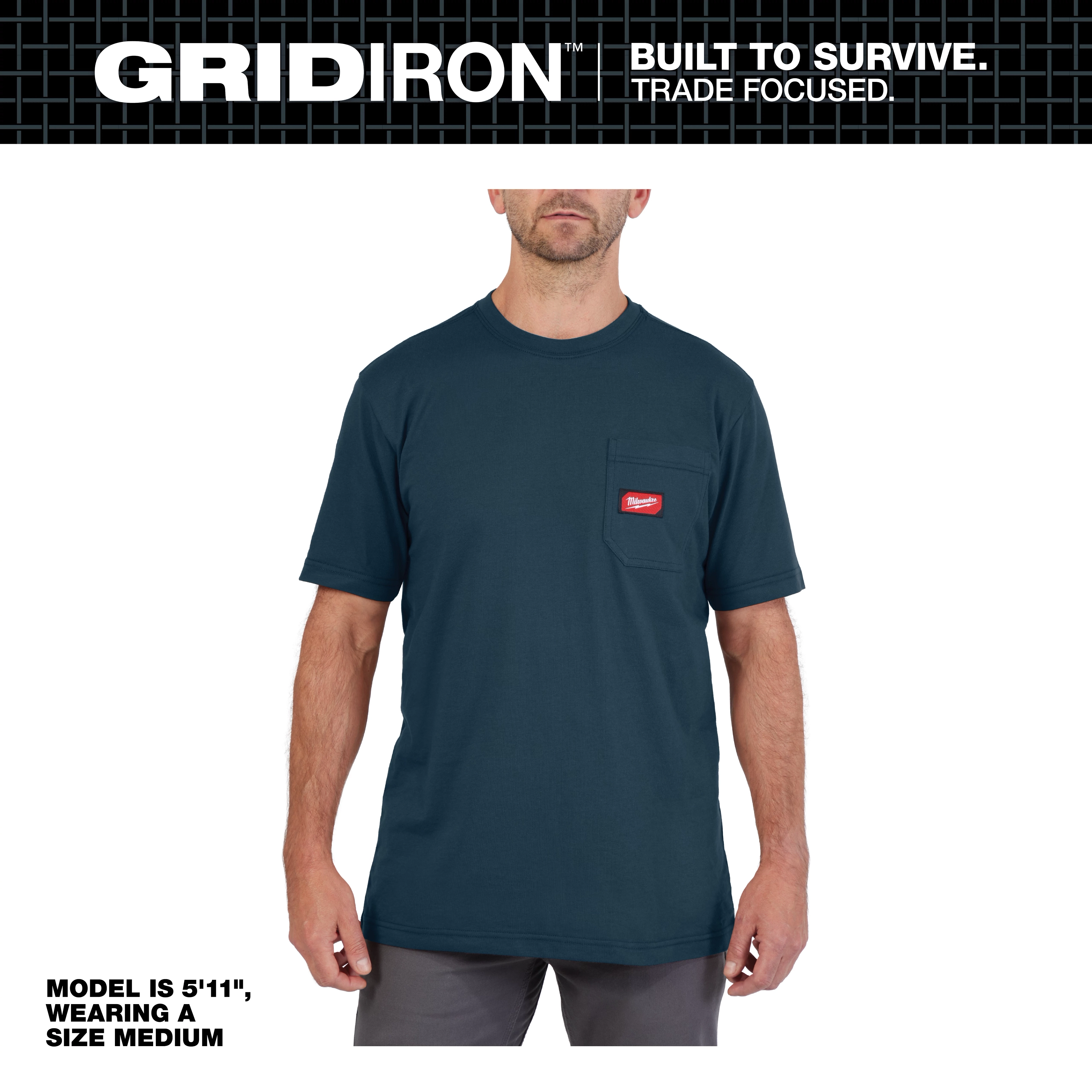 Model wearing the GRIDIRON Pocket T-Shirt - Short Sleeve, size medium in navy. T-shirt features a chest pocket with a red logo tag.