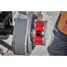 Worker using the 1-1/4" ALLOY NPT Compact Forged Aluminum Die Head