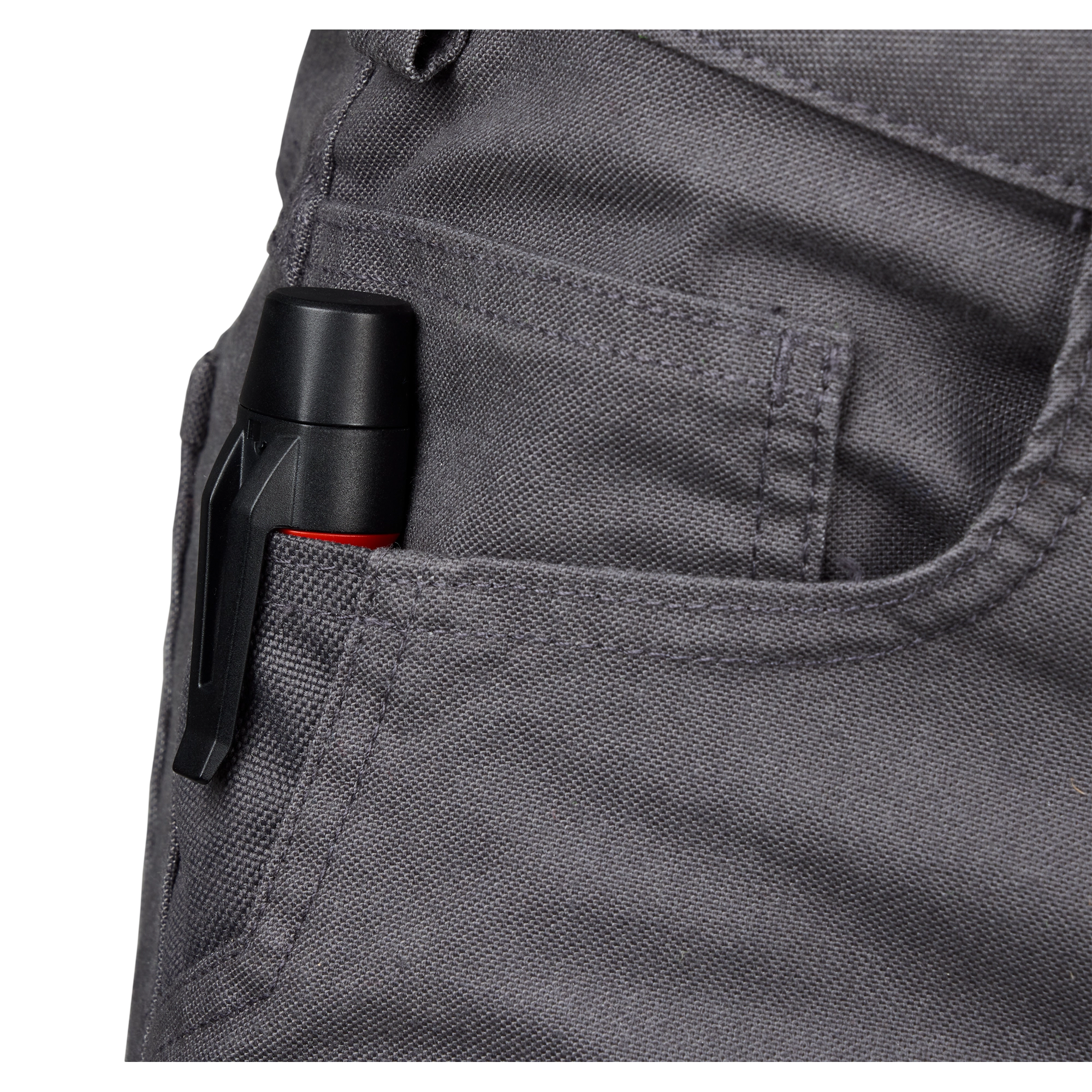 The Dual Range Voltage Detector with LED is shown clipped inside a gray fabric pocket. The device is black with a red accent, easily portable, and designed for convenient, everyday use.