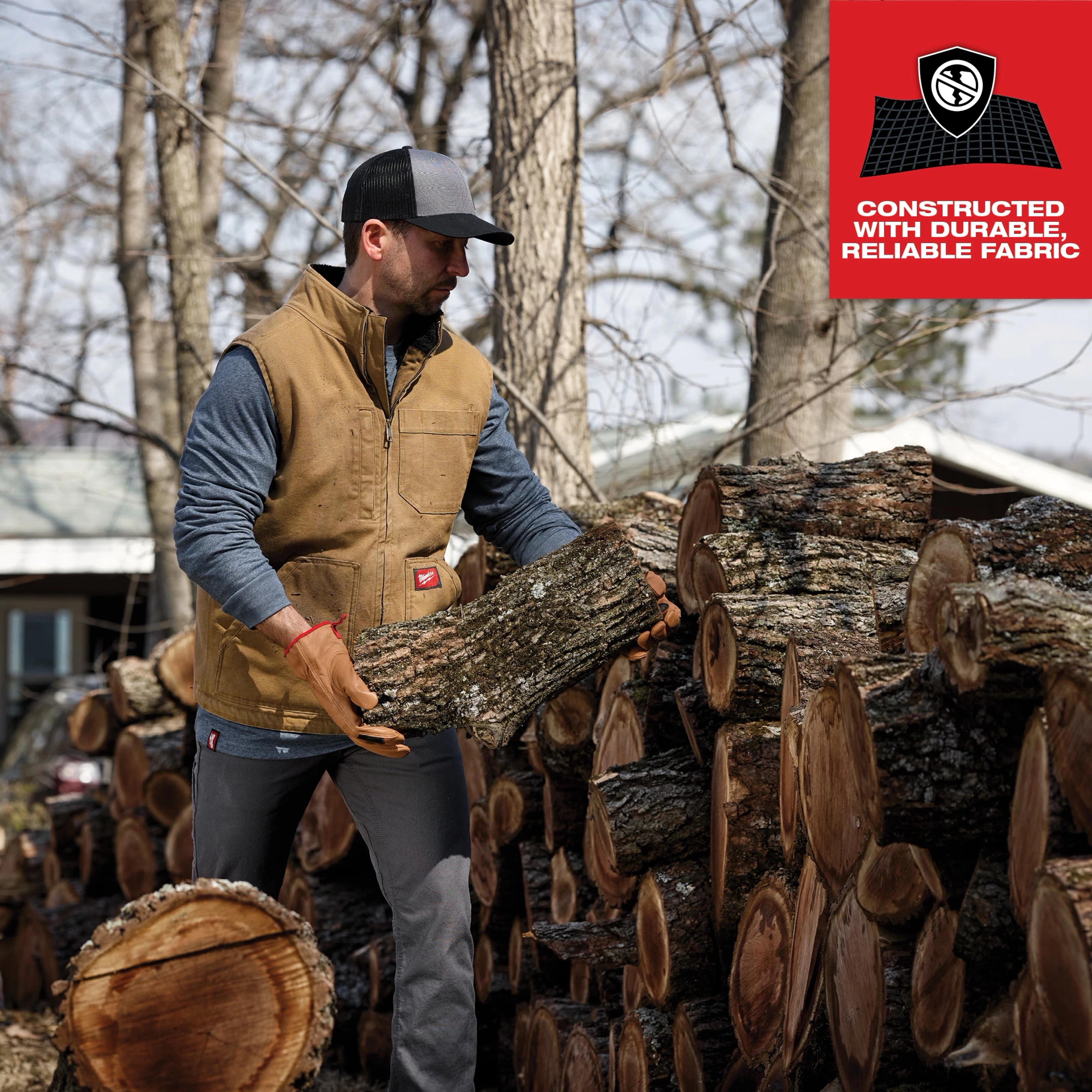 Man wearing the Heavy Duty Sherpa-Lined Vest while handling firewood, with text highlighting the vest's durable, reliable fabric.