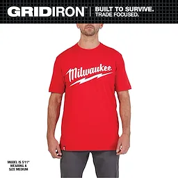 Heavy Duty Tee Primary Image: A model wearing a red t-shirt with white Milwaukee logo and lightning bolt design, size medium.