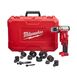 The M18™ FORCE LOGIC™ 6T Knockout Tool 1/2" - 2" w/ Punches & Dies is shown with a red carrying case and several black punches and dies. The tool has a red and black ergonomic design and features a metallic knockout head. The product and case bear the Milwaukee logo.