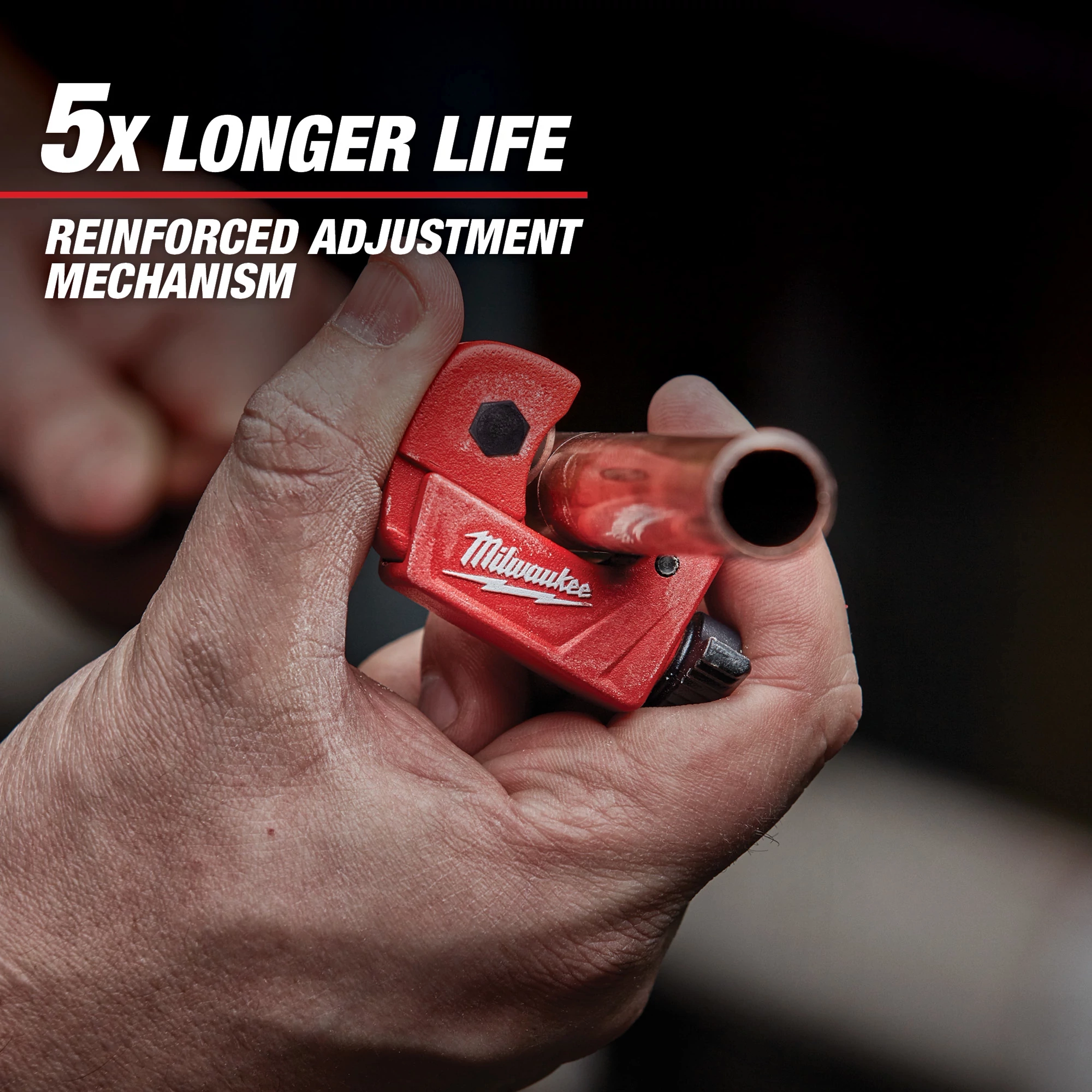 A person uses a Milwaukee pipe cutter on a copper pipe. The product is red with a black adjustment dial. Text on the image claims the tool has "5x longer life" and a "reinforced adjustment mechanism."