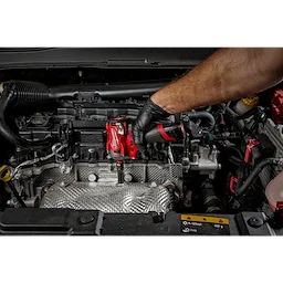 Mechanic using a red impact wrench with a SHOCKWAVE%20Impact%20Duty%201/4%22%20Drive%2014MM%20Deep%206%20Point%20Socket on a car engine.
