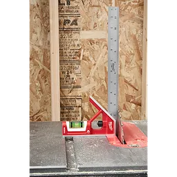 12" Magnetic Combination Square with red body and silver ruler, measuring blade angle on table saw against wooden background.