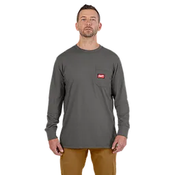 Heavy Duty Pocket T-Shirt in Gray features a long-sleeve design with a chest pocket displaying a red logo patch, worn with tan pants.