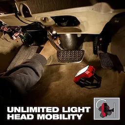 Milwaukee Rechargeable Pivoting Task Light w/ Spot Mode illuminating work under a vehicle dashboard.