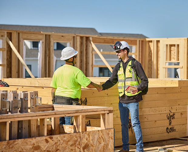 Milwaukee Tool collaborating with skilled tradespeople on a construction site to support workforce development, jobsite productivity, and economic growth in America.