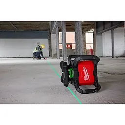 Image of the Milwaukee M18 Green Interior Rotary Laser Level Kit w/ Remote/Receiver & Wall Mount Bracket being used on a jobsite floor