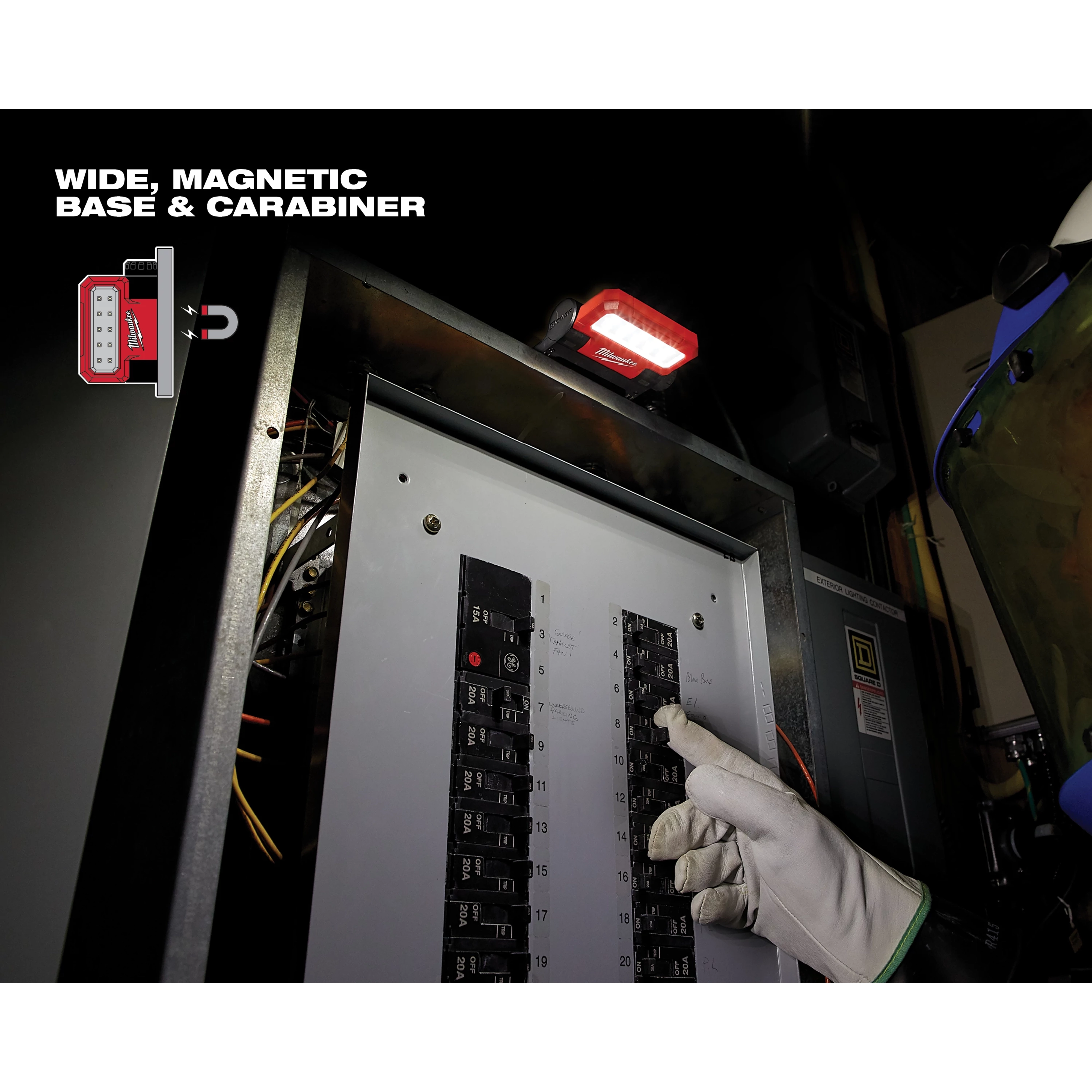 A REDLITHIUM USB ROVER Pivoting Flood Light is mounted above an electrical panel, illuminating it as a gloved hand works.