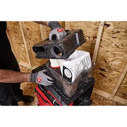 Worker opens M18 FUEL 4 Gallon Wet/Dry Vacuum w/ PACKOUT Compatibility & VACLINK to access filter and dust bag.